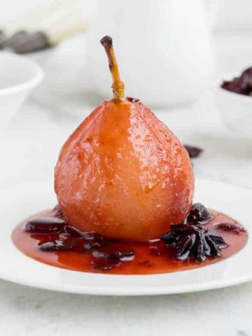 Poach pears in cranberry sauce
