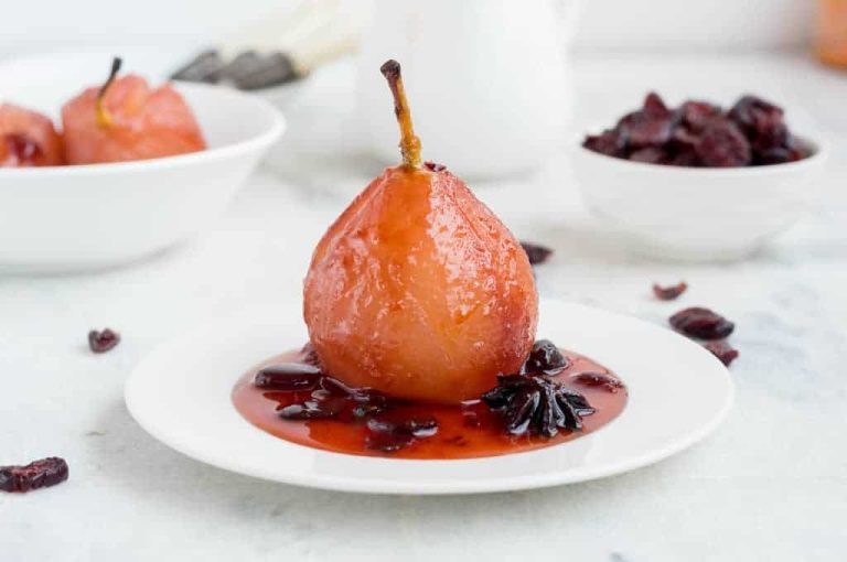 Pears poached in spiced cranberry juice