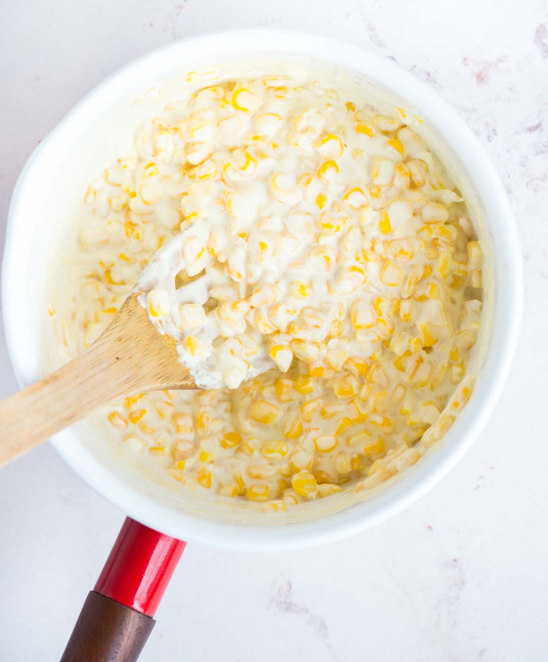 Learn how to make Creamed Corn from scratch. Fresh Corn, butter, flour roux and half&amp; half is all you need to make this easy and creamy creamed corn recipe.
