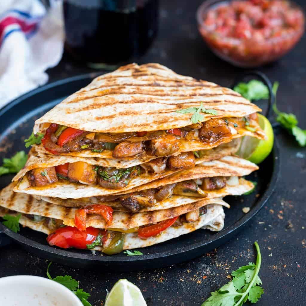 Veggie Quesadilla- These Mexican quesadillas are stuffed with caramelized pumpkins, mushroom, crunchy peppers, generously seasoned with spicy fajita seasoning and topped with cheese.