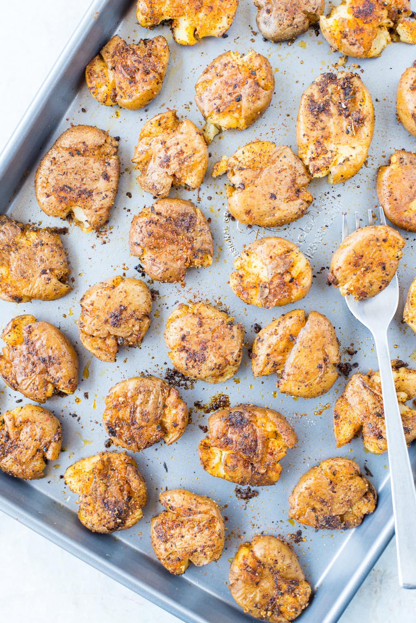 Baked Crispy Cajun Potatoes are seasoned with spicy Cajun spice mix and baked until perfectly crisp on the outside. These crispy baby potatoes made with only three ingredients addictive and a crowd pleaser for sure. 