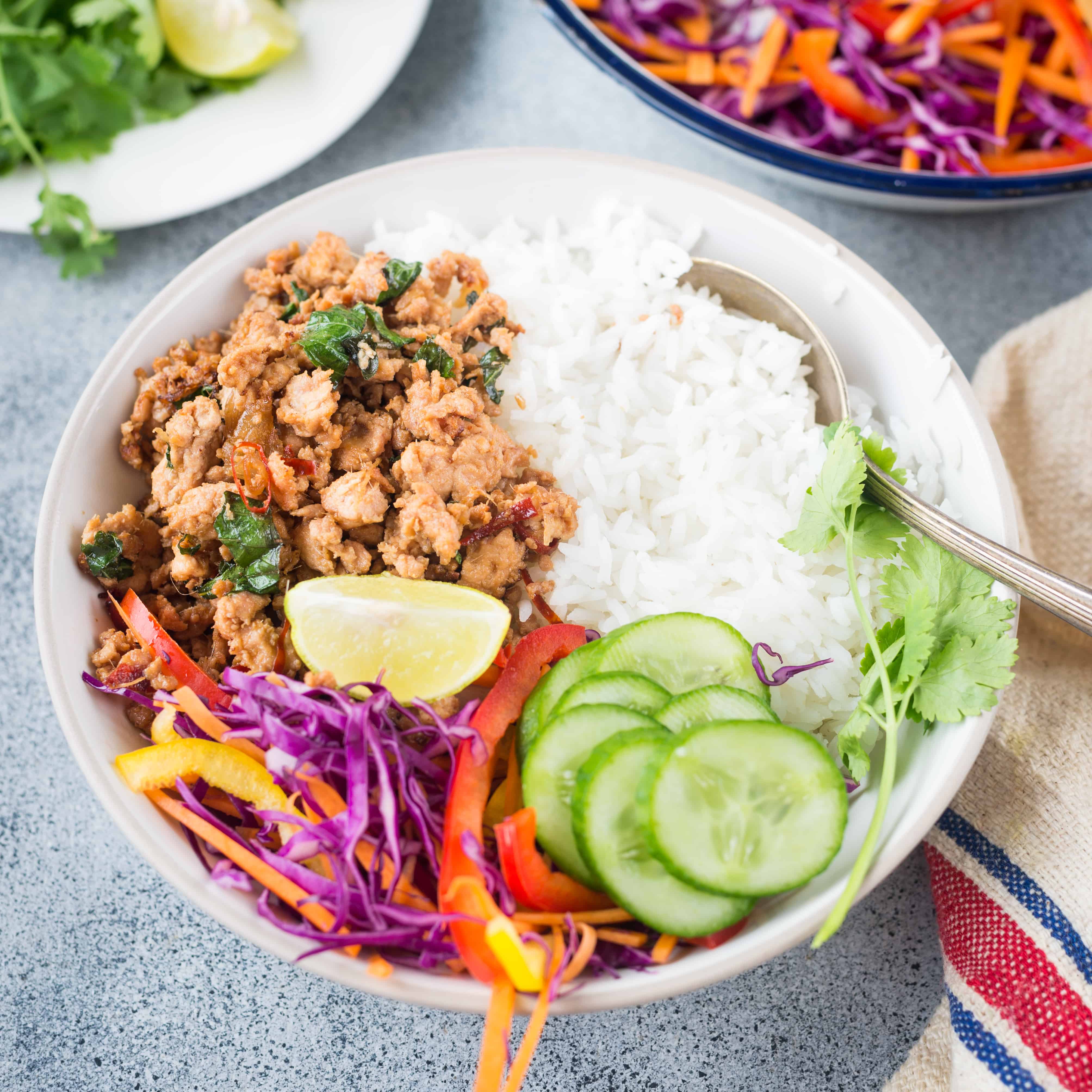 Thai Basil Chicken, this stir fry is spicy, flavourful with real Thai flavour from Thai basil and takes only 15 minutes to make. Serve it with a bowl of jasmine rice and a fried egg or fresh salad.