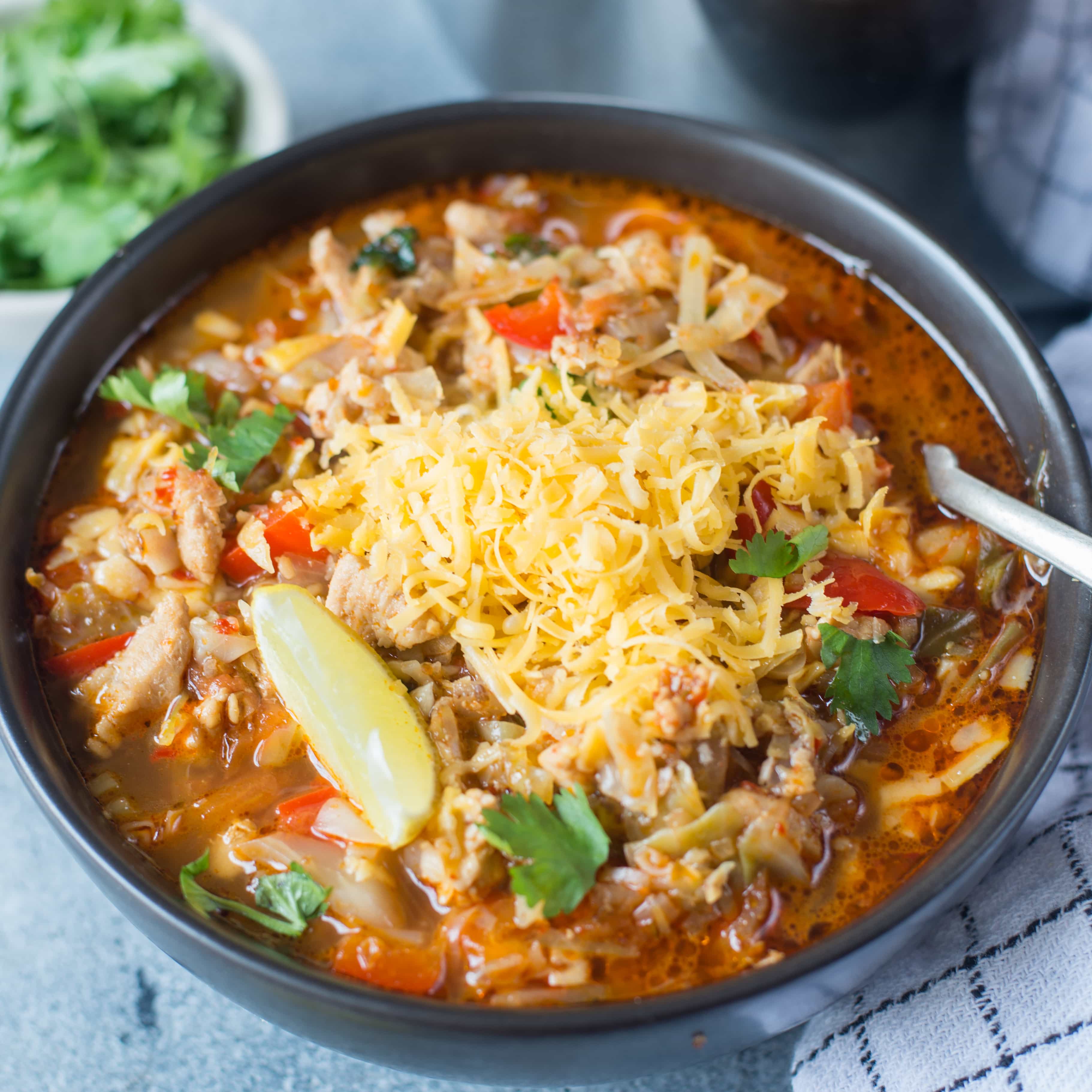This Low Carb Chicken Taco Soup with cabbage is light, healthy and perfect if you are on a weight loss journey. It is also a Keto friendly recipe. Just add Corn, Kidney beans and top it with nachos to make it more wholesome.