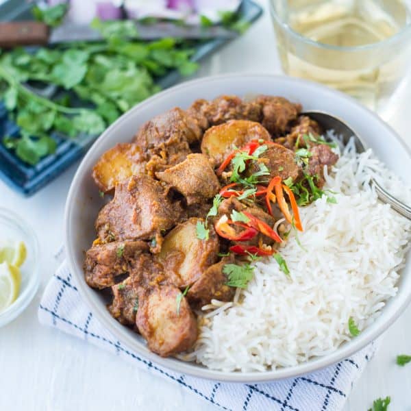 Slow Cooker Indian Lamb Curry6 Lamb and potatoes cooked slowly in onion tomato gravy and Indian Spices. This basic Indian Mutton Curry with juicy tender pieces of Mutton is perfect for a leisurely Sunday family meal.