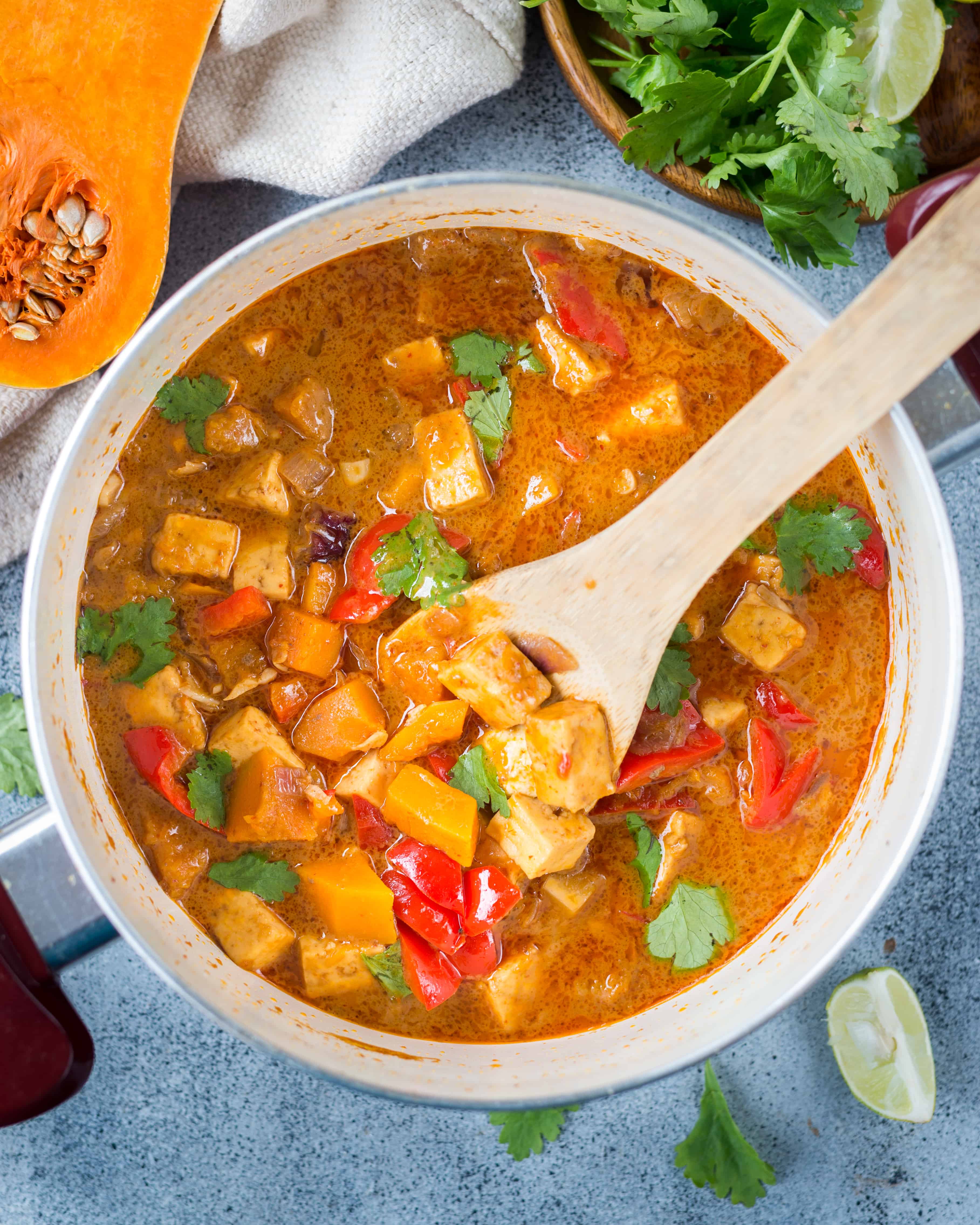 Butternut Squash curry shown served in a bowl with a spoon. 