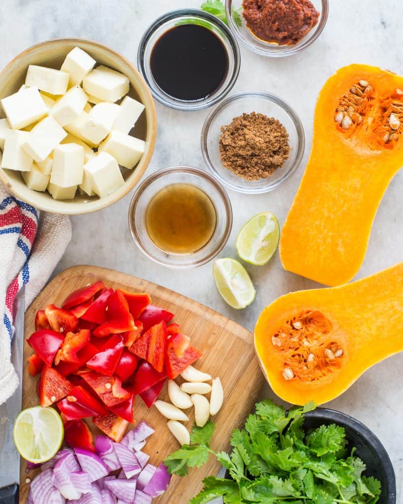 Picture of all ingredients arranged on a table to make butternut squash curry recipe