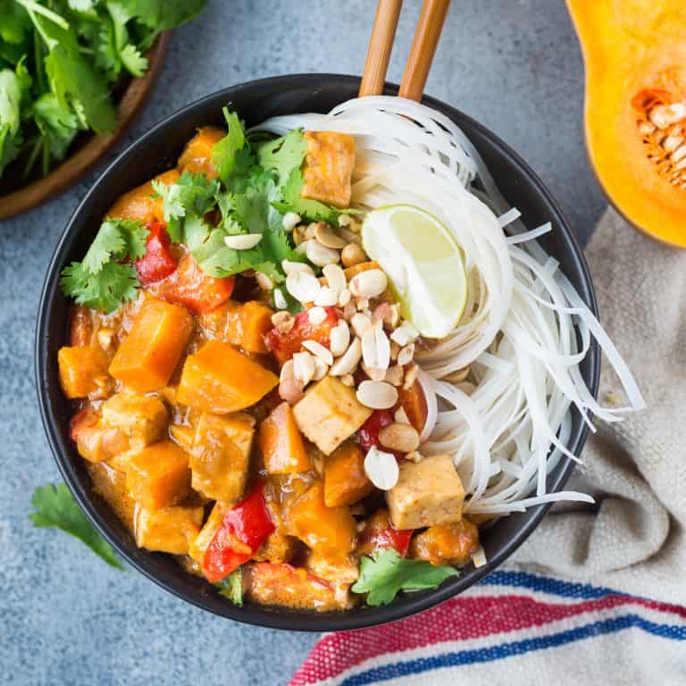 Thai Squash Tofu Curry in a plate with noodles.