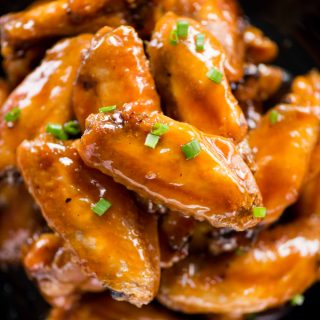 Crispy baked chicken wings are tossed in a sweet, sour and sticky sauce. These chicken wings are addictive and perfect party appetizer. 