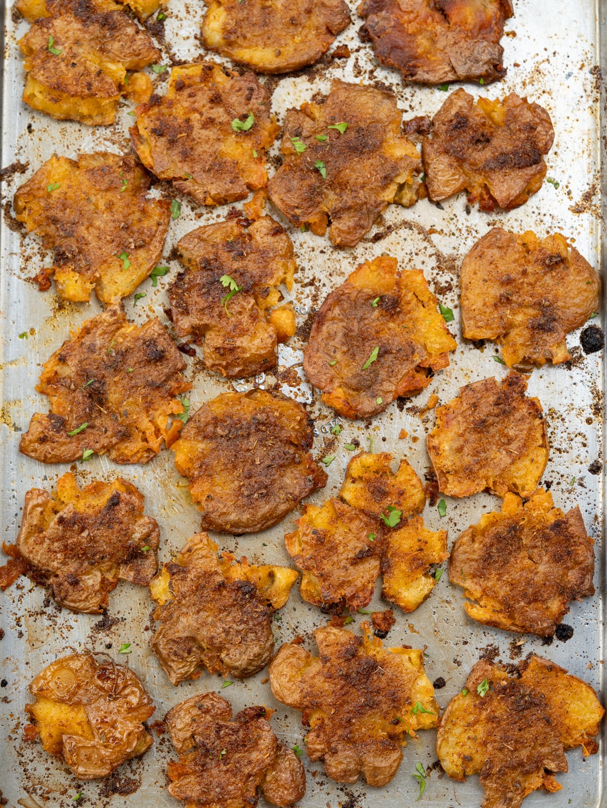 Baby potatoes tossed in cajun butter seasoning, smashed and baked until crispy.