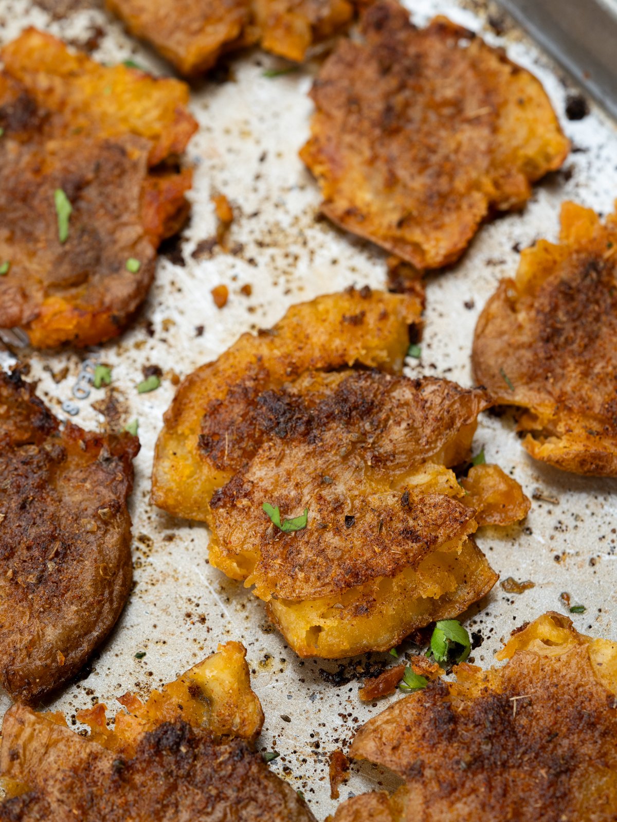 Baby potatoes tossed in cajun butter seasoning, smashed and baked until crispy.