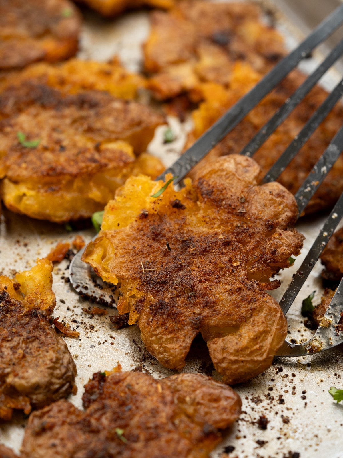 Baby potatoes seasoned in cajun butter seasoning, smashed and baked until crispy around the edges. 