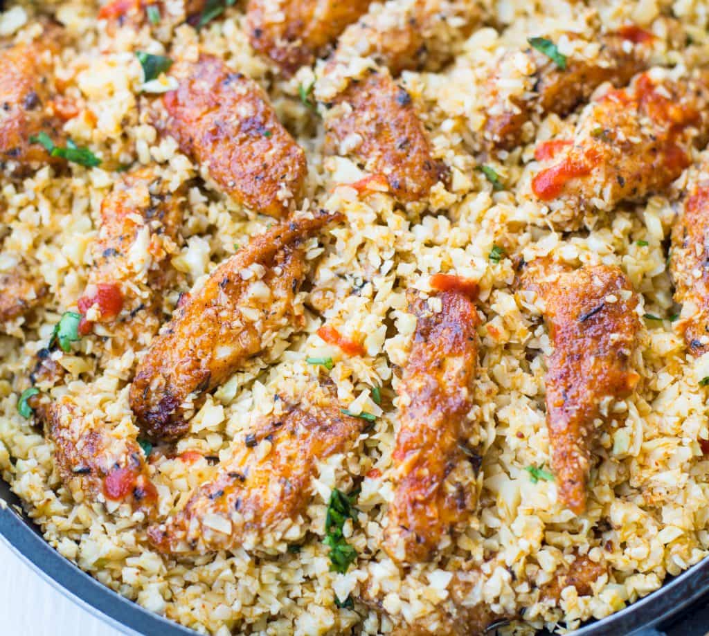 Close shot showing Cauliflower rice made with nutty cauliflower and garlic chicken. 