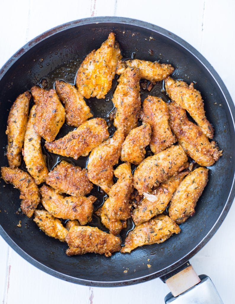 Garlic chicken prepared with a cheese and seasoning of herbs and paprika and made crispy in a skillet