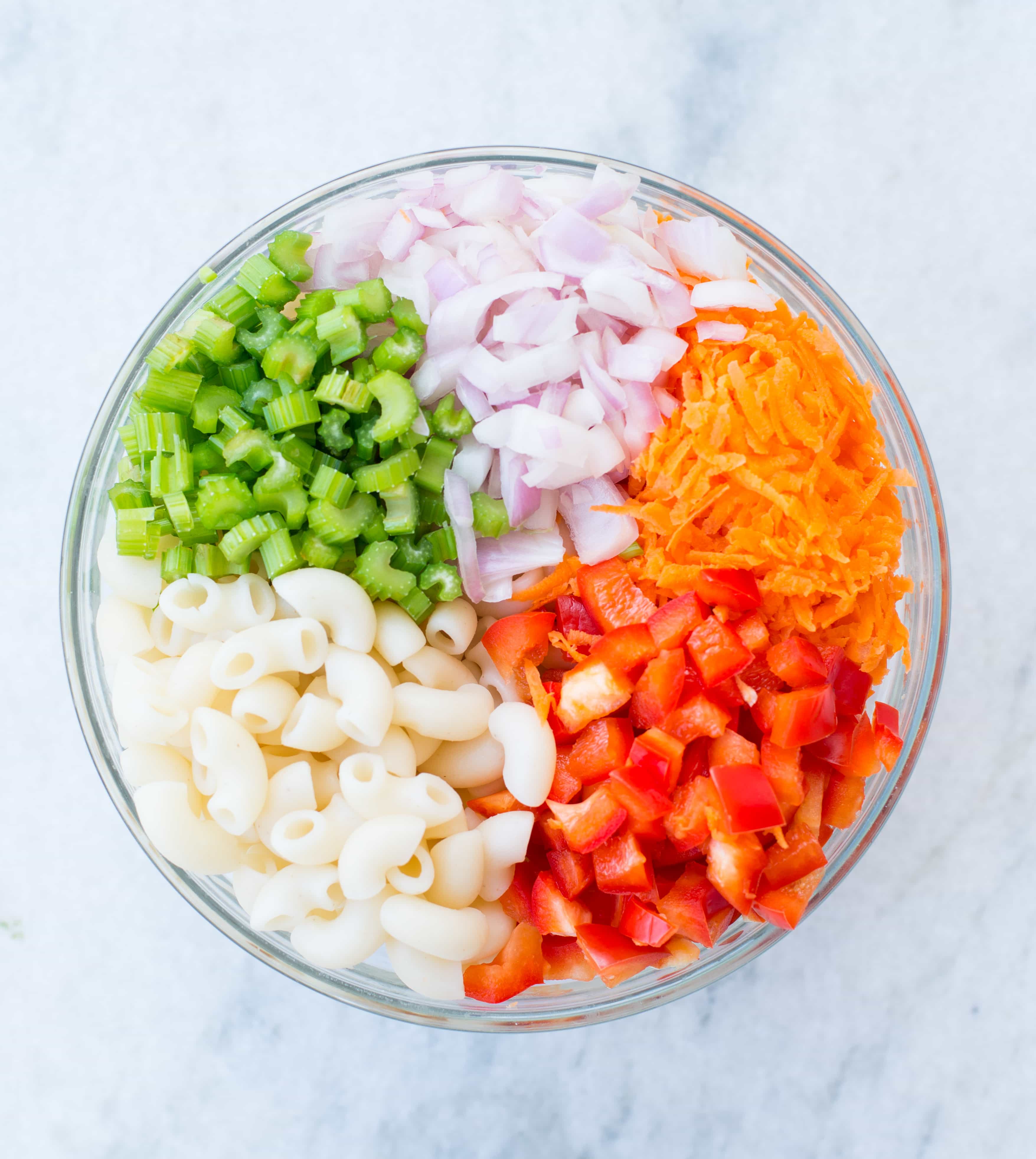 Delicious Vegan Macaroni Salad is a perfect side for Picnic, potluck or Barbecue. This Vegan Pasta salad is creamy with crisp vegetables and a light Tahini Cashew Dressing.