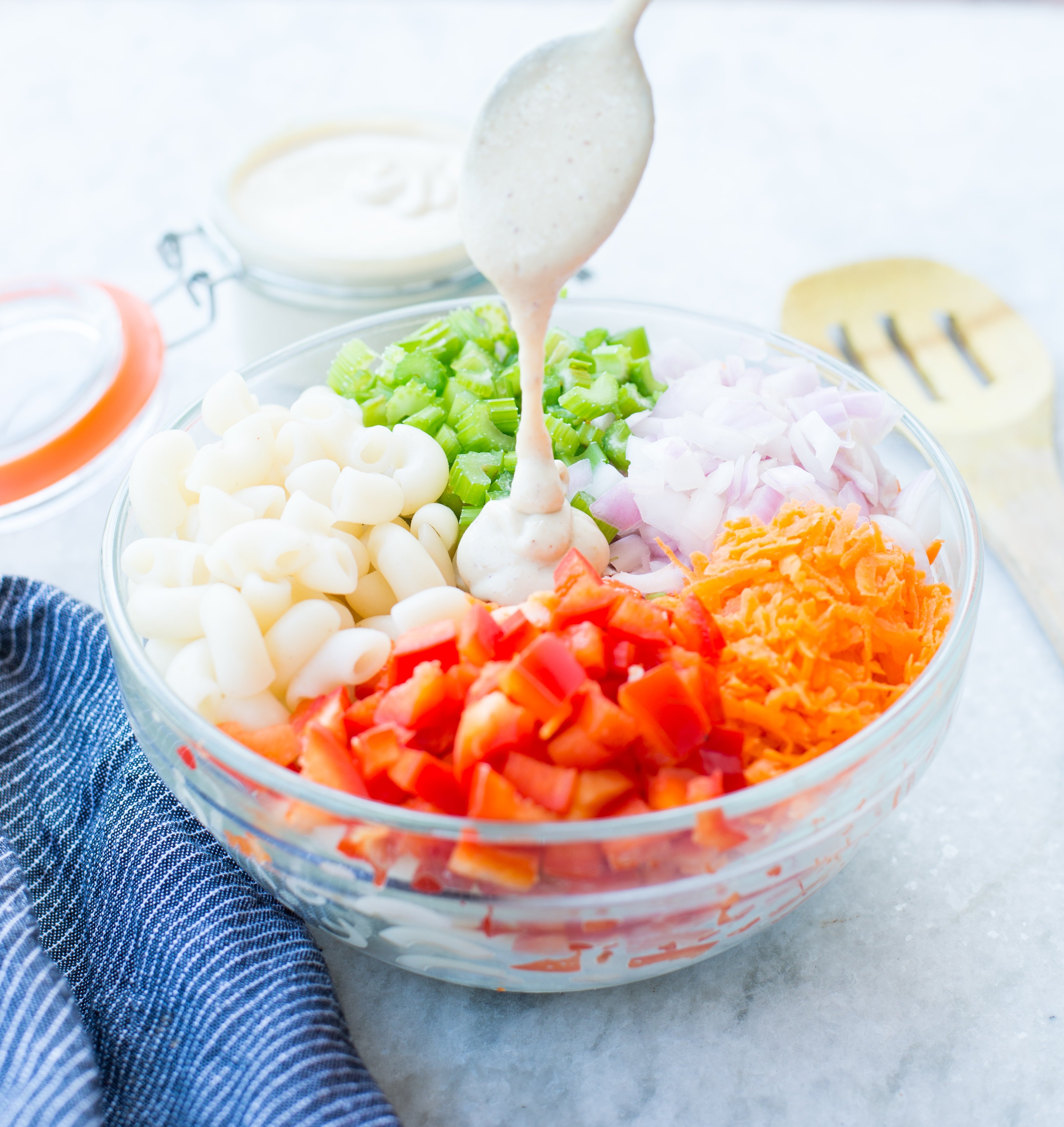 Delicious Vegan Macaroni Salad is a perfect side for Picnic, potluck or Barbecue. This Vegan Pasta salad is creamy with crisp vegetables and a light Tahini Cashew Dressing.