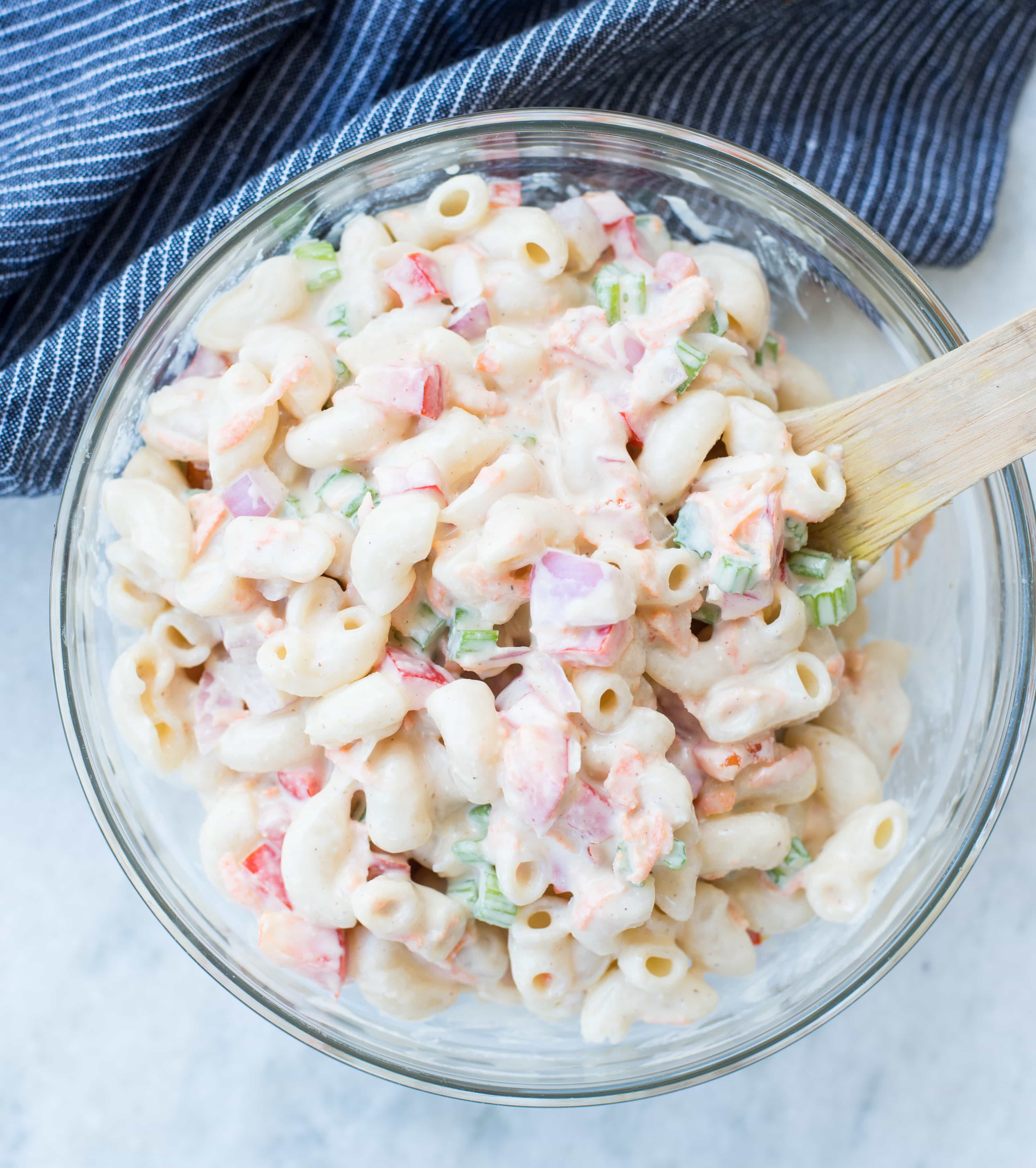 Delicious Vegan Macaroni Salad is a perfect side for Picnic, potluck or Barbecue. This Vegan Pasta salad is creamy with crisp vegetables and a light Tahini Cashew Dressing.