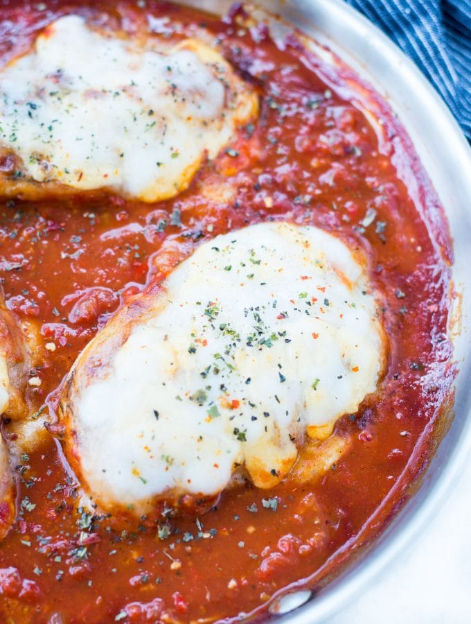 This Easy Mozzarella Chicken in homemade tomato sauce is low carb and made in one skillet. Pan Seared Chicken cooked in chunky tomato sauce and topped with gooey mozzarella is a perfect low carb dinner.