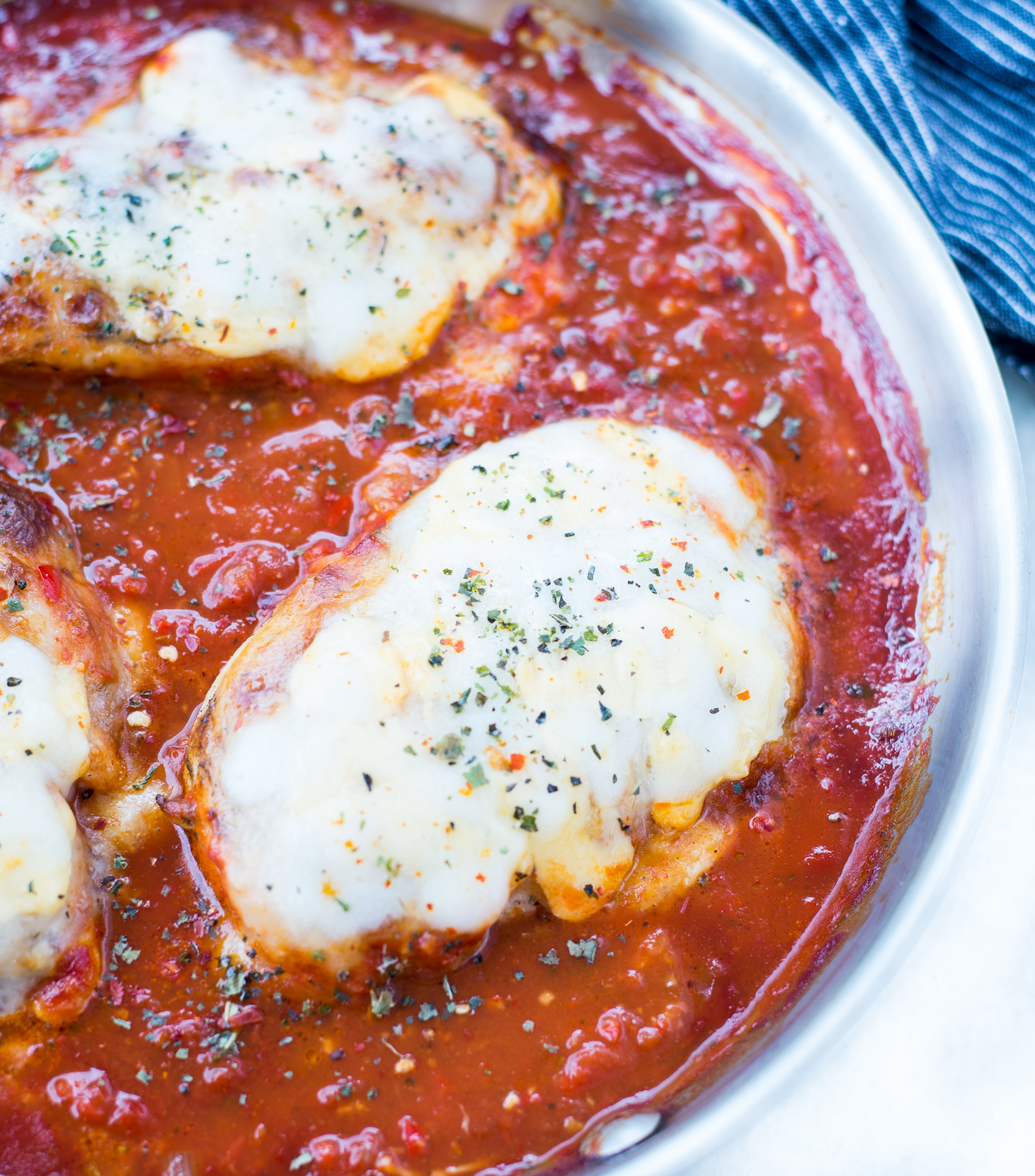 This Easy Mozzarella Chicken in homemade tomato sauce is low carb and made in one skillet. Pan Seared Chicken cooked in chunky tomato sauce and topped with gooey mozzarella is a perfect low carb dinner.