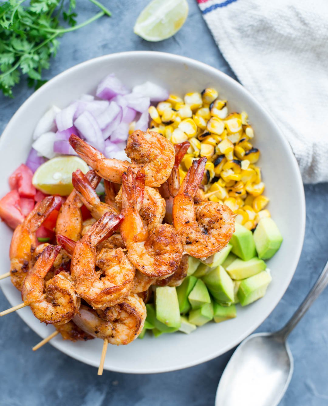 Grilled Shrimp with Corn Avocado Salad is a refreshing salad for warm summer days. Spicy grilled shrimp paired with grilled corn, avocado and other veggies takes only 15 minutes of your time.