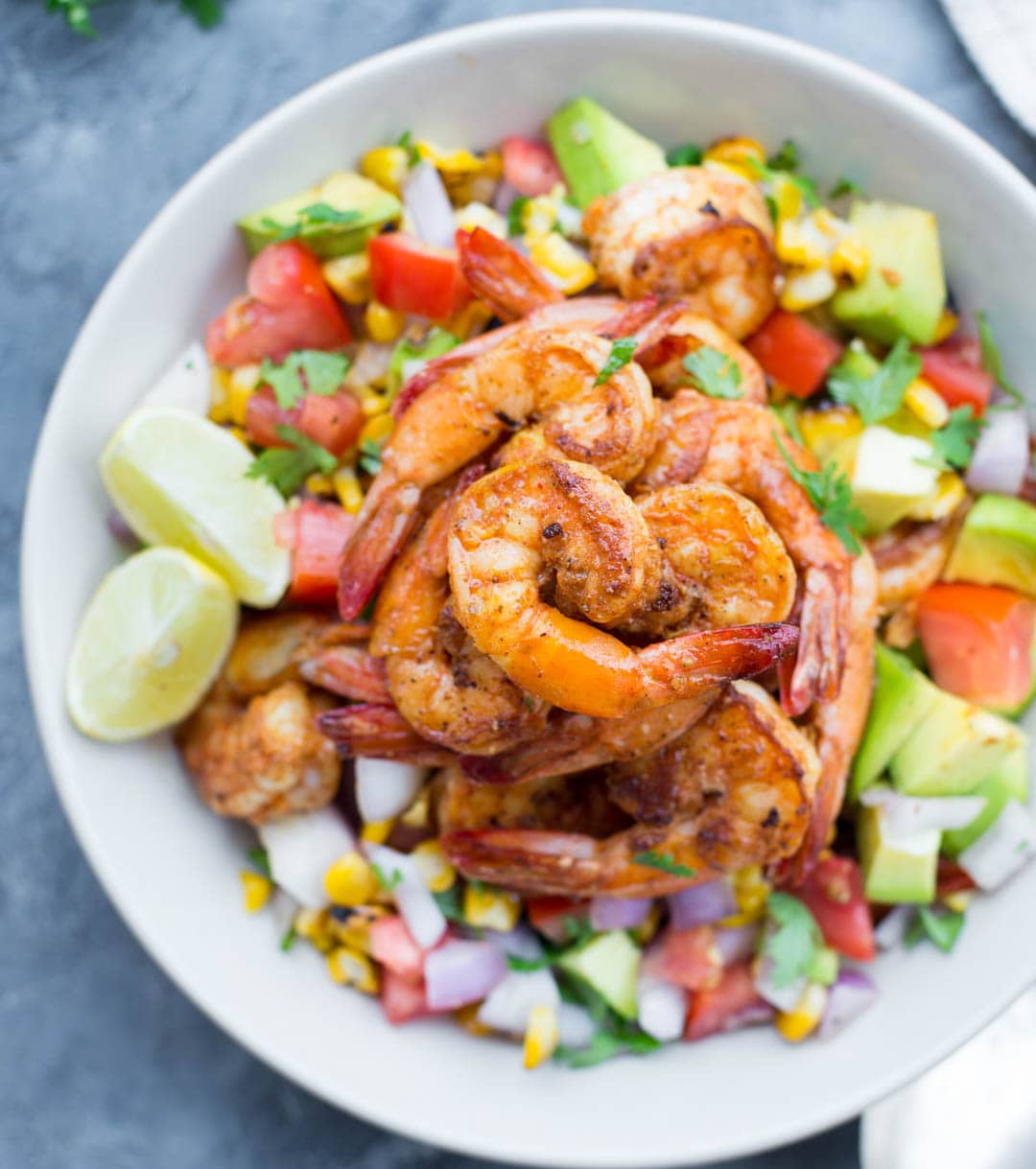 Grilled Shrimp with Corn Avocado Salad is a refreshing salad for warm summer days. Spicy grilled shrimp paired with grilled corn, avocado and other veggies takes only 15 minutes of your time.