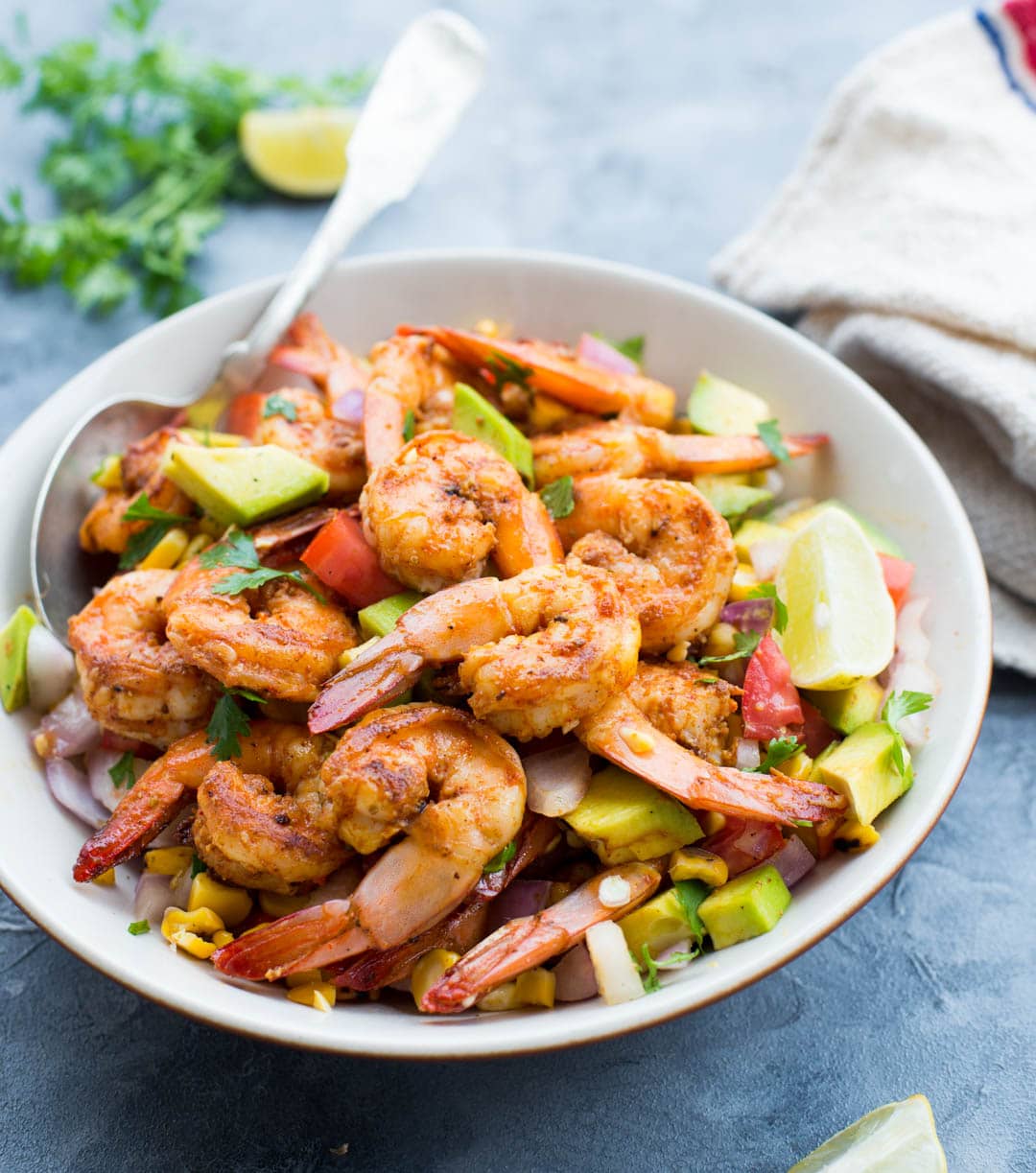 Grilled Shrimp with Corn Avocado Salad is a refreshing salad for warm summer days. Spicy grilled shrimp paired with grilled corn, avocado and other veggies takes only 15 minutes of your time.