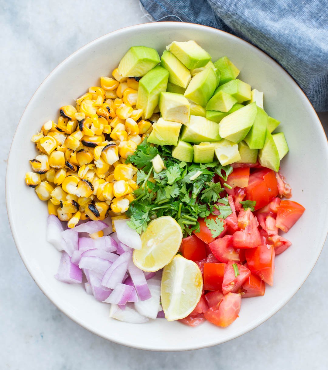 Grilled Shrimp with Corn Avocado Salad is a refreshing salad for warm summer days. Spicy grilled shrimp paired with grilled corn, avocado and other veggies takes only 15 minutes of your time.