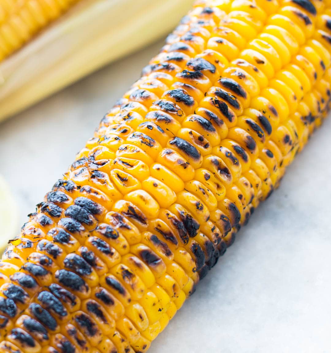 Grilled Shrimp with Corn Avocado Salad is a refreshing salad for warm summer days. Spicy grilled shrimp paired with grilled corn, avocado and other veggies takes only 15 minutes of your time.