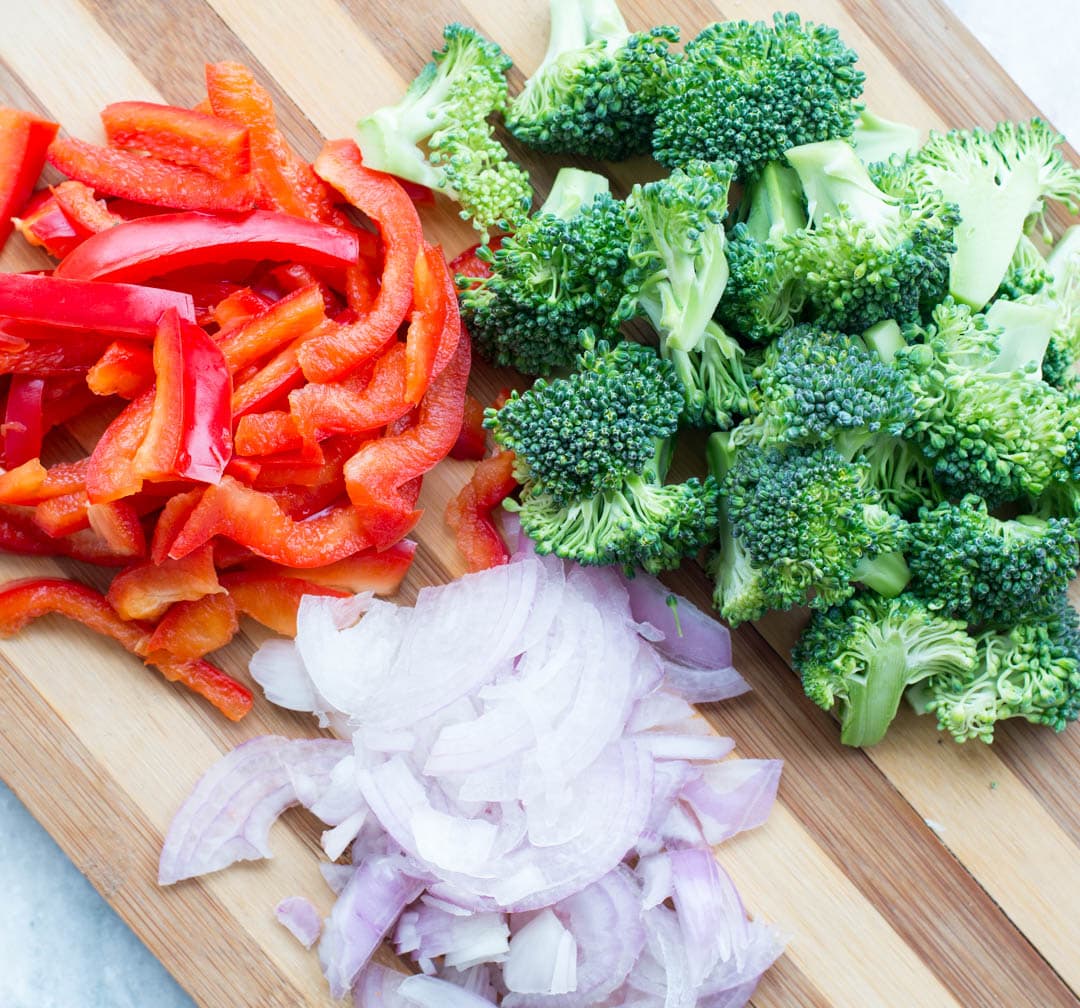 Vegetables like onions, broccoli, chili-peppers cut for ramen noodles stir-fry