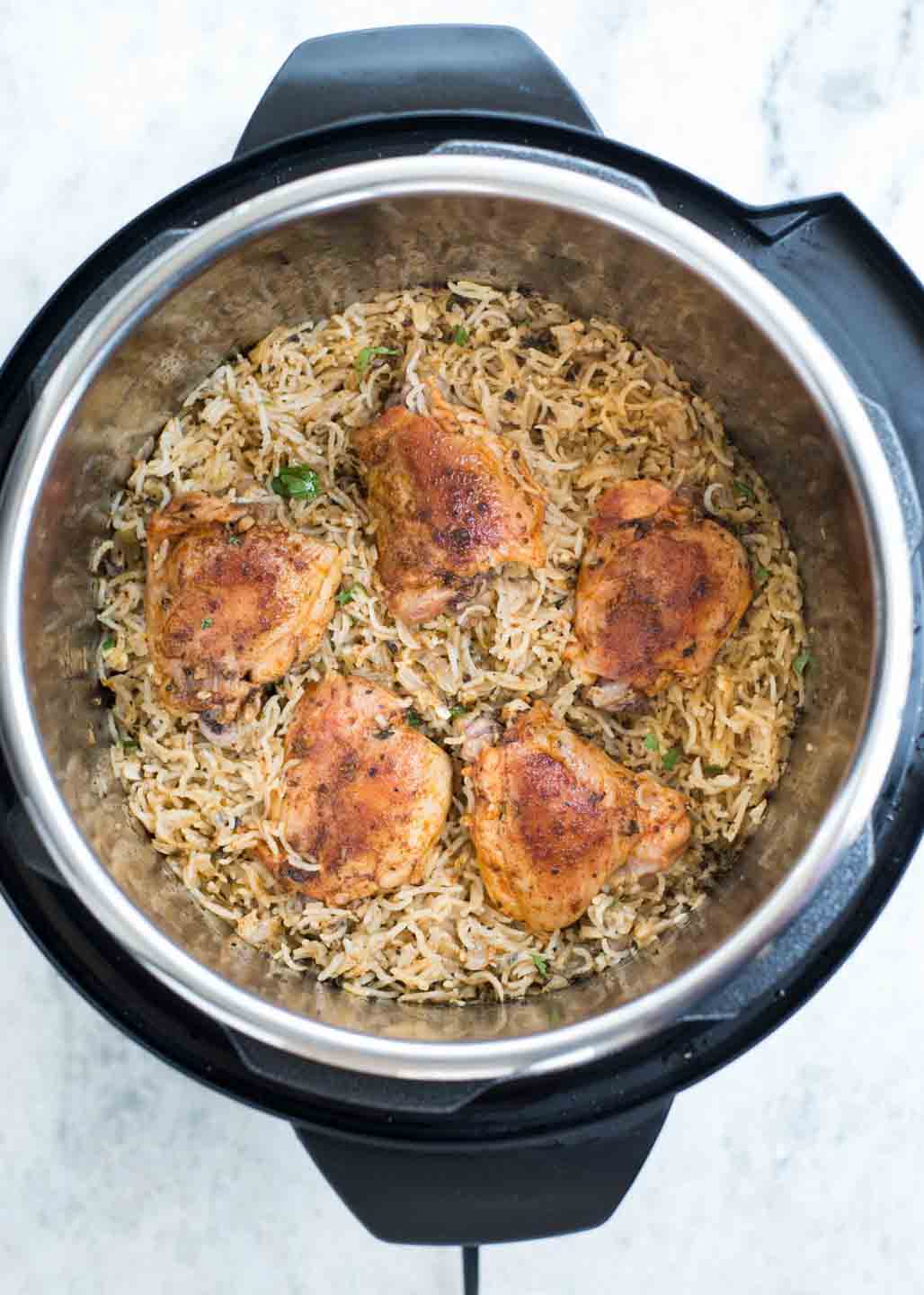 Instant Pot Chicken and Rice made in the Instant Pot with fluffy buttery rice and Juicy Chicken thighs made in 20 minutes