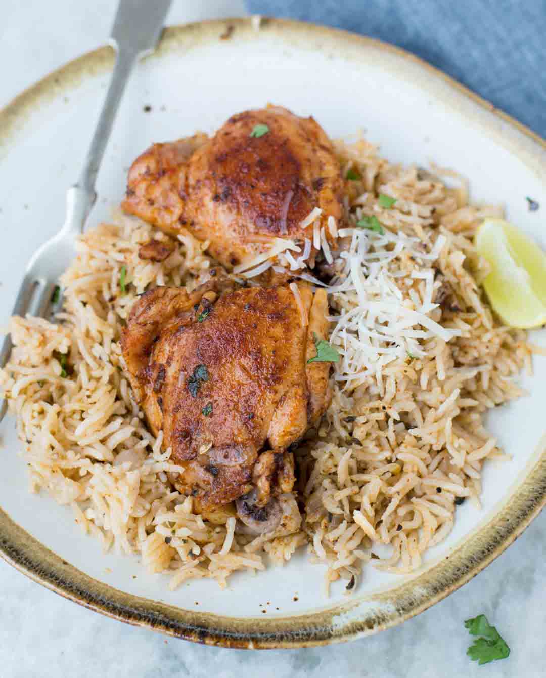 Instant Pot Chicken and Rice made in the Instant Pot with fluffy buttery rice and Juicy Chicken thighs. 