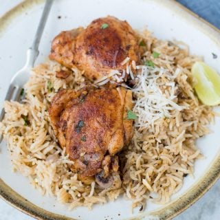 This Instant Pot Chicken and rice is a wholesome dinner that the entire family will love. Garlic Herb Chicken and Rice made in the Instant Pot have fluffy buttery rice and Juicy Chicken thighs.