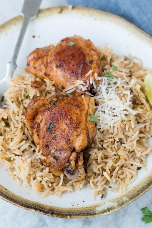 This Instant Pot Chicken and rice is a wholesome dinner that the entire family will love. Garlic Herb Chicken and Rice made in the Instant Pot have fluffy buttery rice and Juicy Chicken thighs.