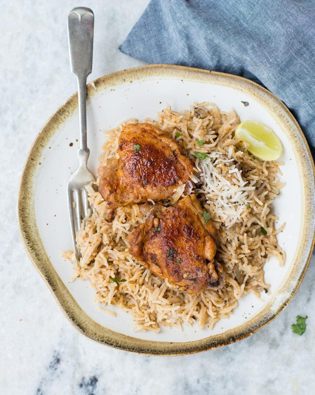 Instant Pot Chicken and Rice made in the Instant Pot with fluffy buttery rice and Juicy Chicken thighs. 