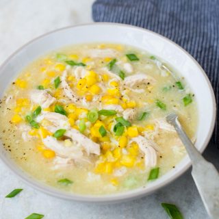 Corn chicken soup served in a white bowl is creamy, has rich flavors and soothing textures.