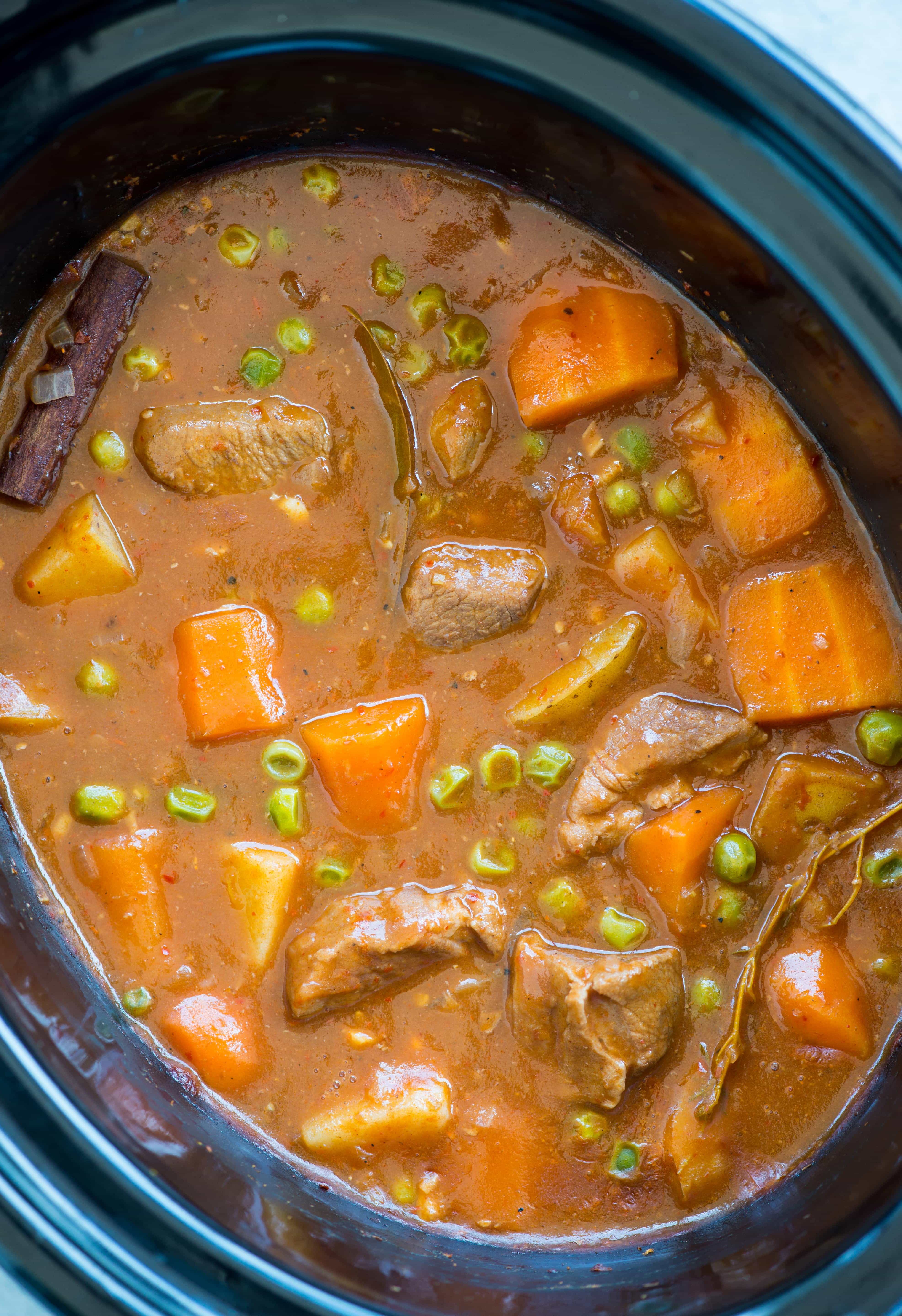 Slow Cooker Lamb Stew with tender fall apart lamb chunks and hearty vegetables have a rustic flavourful wine based gravy. This Lamb Stew is definitely going to keep you warm in the winter.