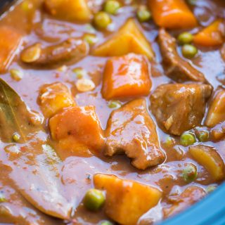 Slow Cooker Lamb Stew with tender fall apart lamb chunks and hearty vegetables have a rustic flavourful wine based gravy. This Lamb Stew is definitely going to keep you warm in the winter.