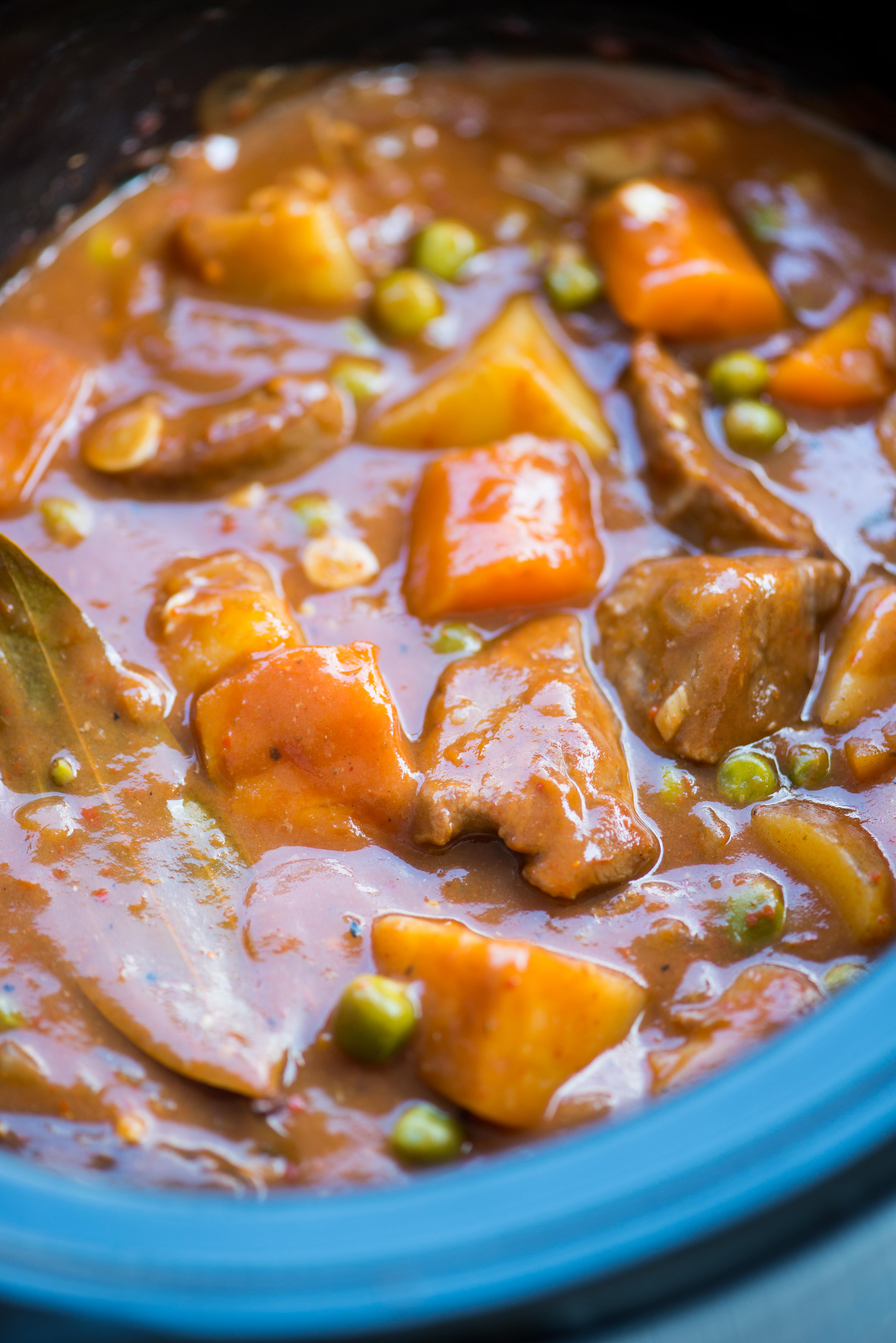 Slow Cooker Lamb Stew with tender fall apart lamb chunks and hearty vegetables have a rustic flavourful wine based gravy. This Lamb Stew is definitely going to keep you warm in the winter.