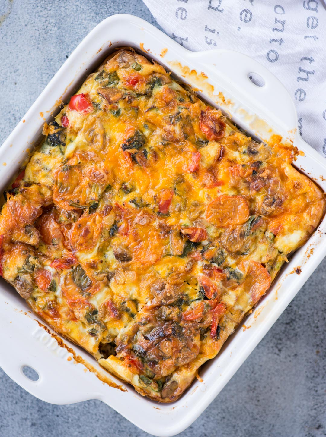 Easy breakfast casserole with bread loaded vegetables, egg, bread and topped with cheese. This Breakfast Casserole recipe can be made ahead and perfect to feed a big crowd.