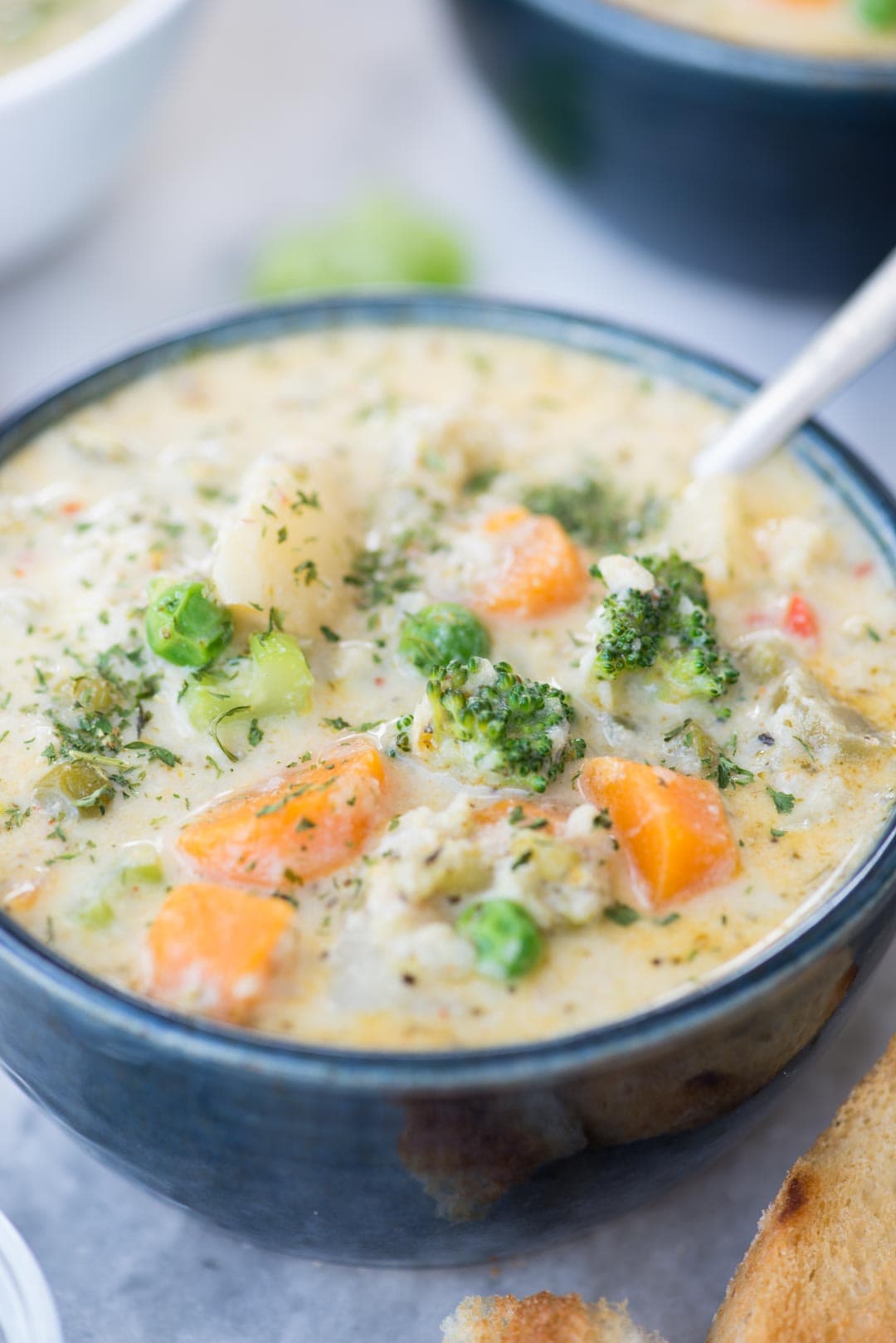 Creamy Vegetable Soup made with loads of vegetable is healthy and gluten-free. The soup has the richness from Parmesan Cheese and is really filling. There are instructions to make this soup both in the Instant Pot and Stovetop.