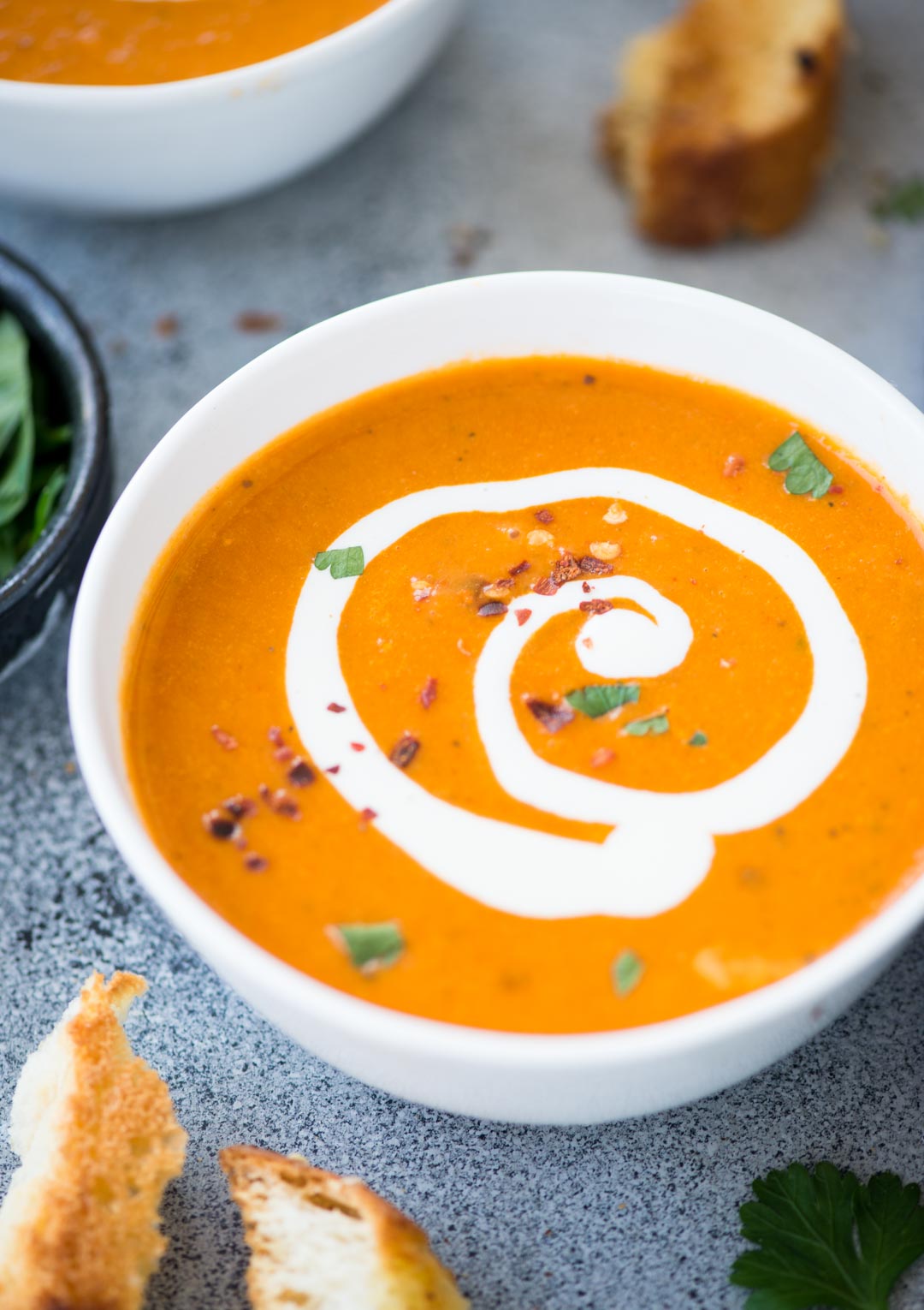 Tomato Bisque with a hint of tartness from the tomatoes, is the perfect soup for cold winter days. It is healthy, gluten-free and easy to make. Serve this with a big slice of crusty garlic cheese toast or grilled cheese.