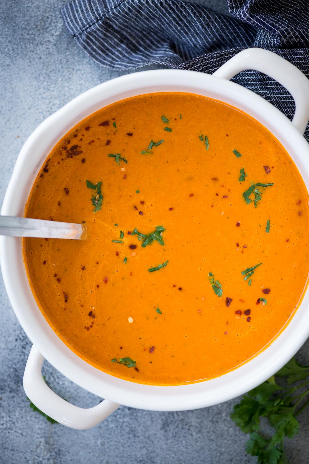 Thick and Creamy Tomato Bisque with a hint of tartness from the tomatoes, is the perfect soup for cold winter days. It is healthy, gluten-free and easy to make. Serve this with a big slice of crusty garlic cheese toast or grilled cheese.