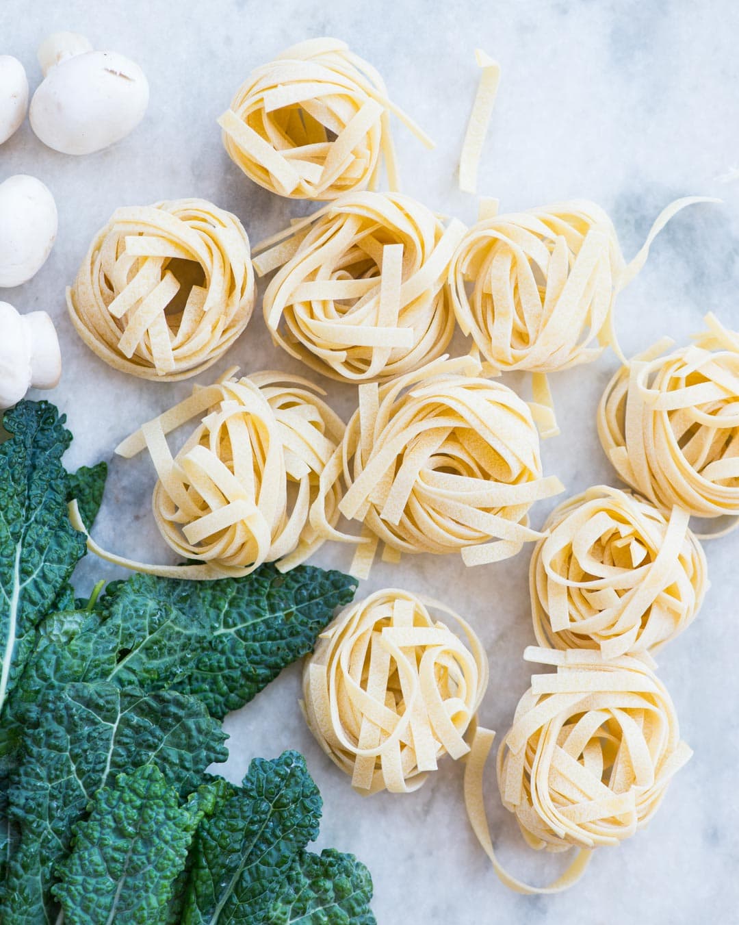 Lemon Garlic Kale Pasta. Pasta, Kale, Mushroom, peas tossed in a buttery lemon garlic sauce and topped with Parmesan. This one-pan delicious dinner is easy and quick to make