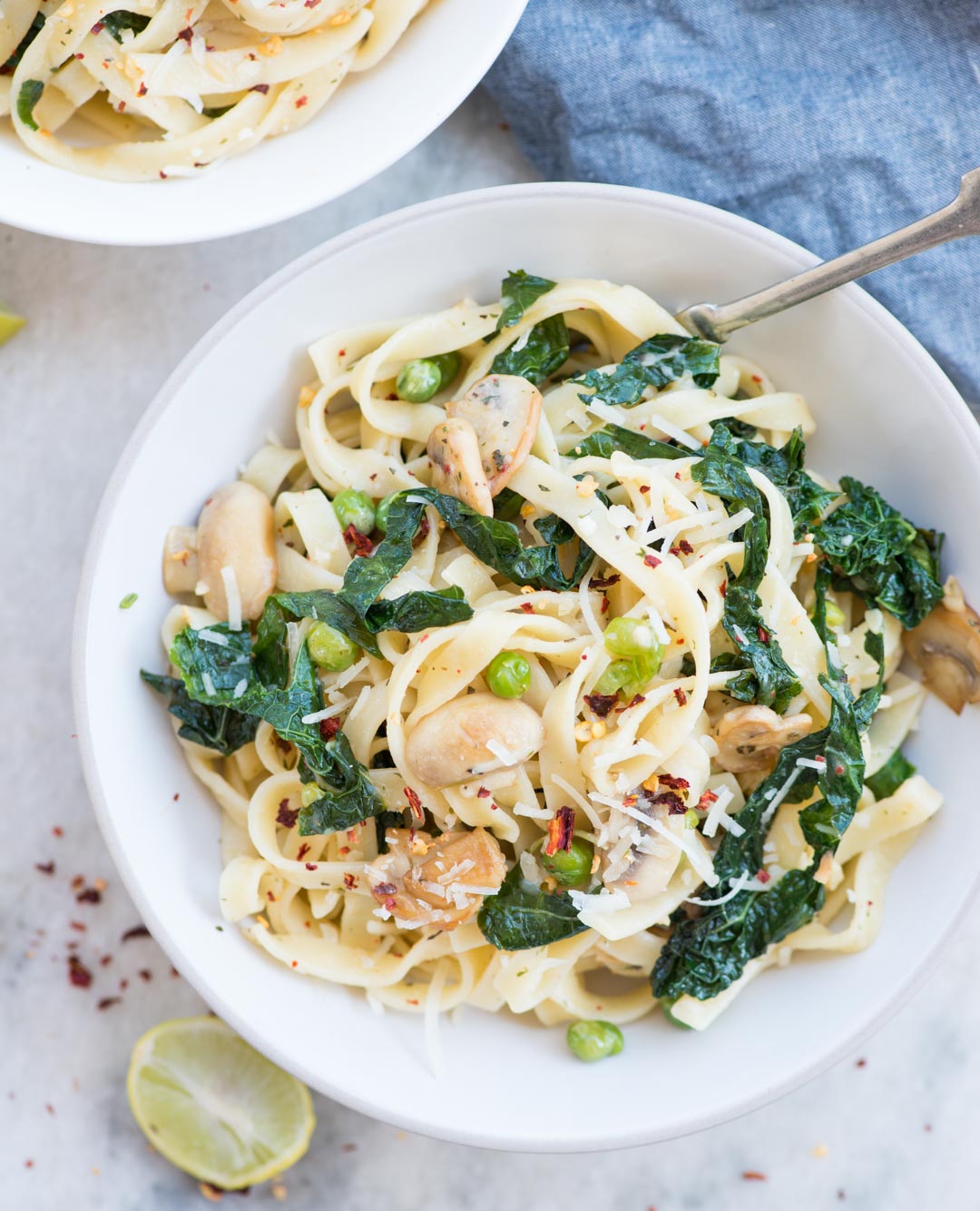 Lemon Garlic Kale Pasta. Pasta, Kale, Mushroom, peas tossed in a buttery lemon garlic sauce and topped with Parmesan. This one-pan delicious dinner is easy and quick to make