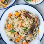 Veg Pualo is an Indian style rice pilaf made with long grain basmati rice, an array of vegetables and whole spices. This fragrant one-pot dish can be made on stove top, in a pressure cooker or in an Instant Pot.