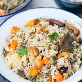 Veg Pualo is an Indian style rice pilaf made with long grain basmati rice, an array of vegetables and whole spices. This fragrant one-pot dish can be made on stove top, in a pressure cooker or in an Instant Pot.