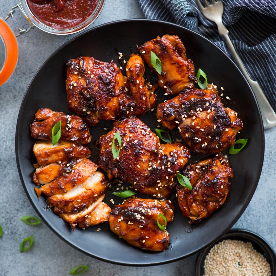 Korean Chicken made with Gochujang, soy sauce based marinade is bold in flavours and really easy to make. Chicken thighs coated in a sweet and spicy sauce and cooked until juicy.