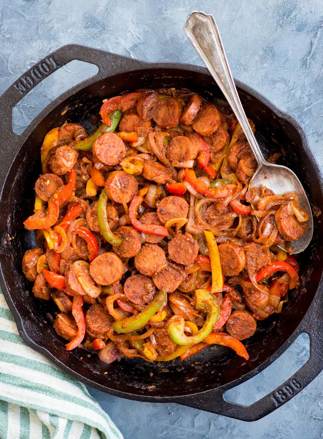 This Cajun Sausage and peppers skillet with caramelized onions, Crunchy peppers,  is so flavourful. You need less than 30 minutes and one pan to make this dinner on a busy weeknight.