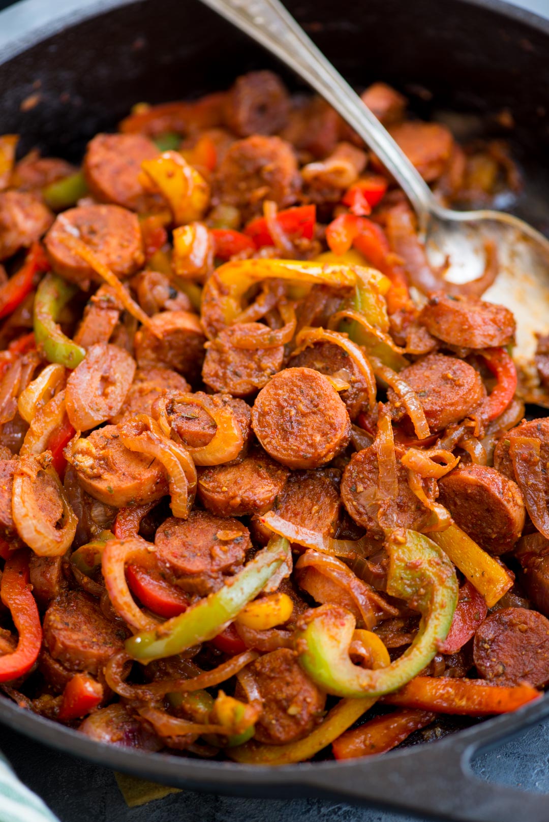 This Cajun Sausage and peppers skillet with caramelized onions, Crunchy peppers,  is so flavourful. You need less than 30 minutes and one pan to make this dinner on a busy weeknight.