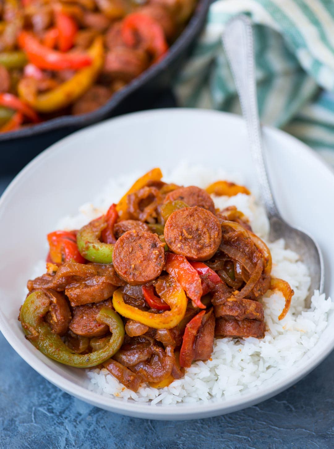 This Cajun Sausage and peppers skillet with caramelized onions, Crunchy peppers,  is so flavourful. You need less than 30 minutes and one pan to make this dinner on a busy weeknight.