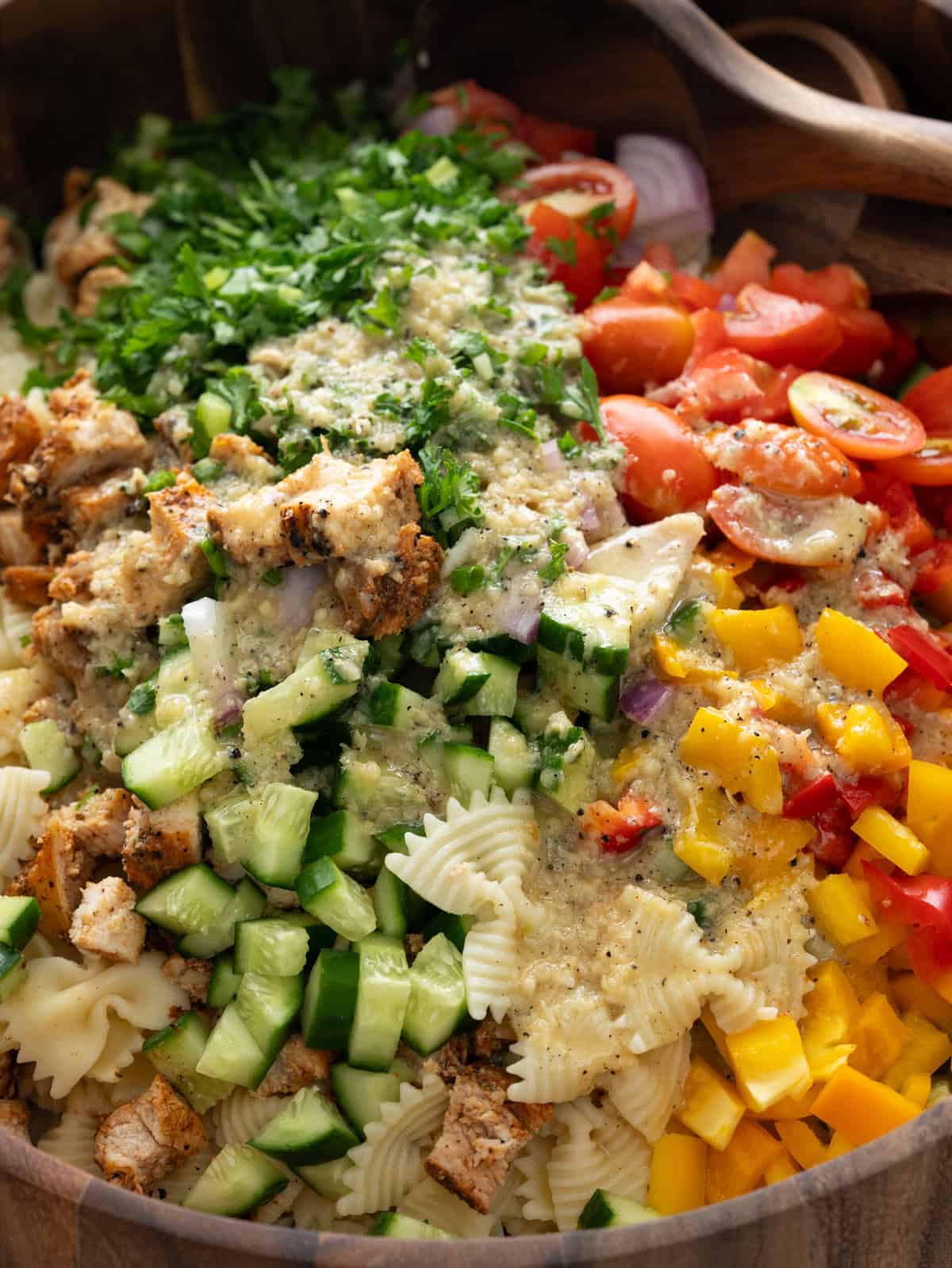 Lemon parmesan dressing poured over cooked pasta, grilled chicken and veggies. 